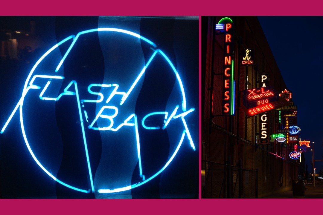 A blue neon sign with the word FLASHBACK inside a circle, beside a few of several neon signs on the side of a large brick building