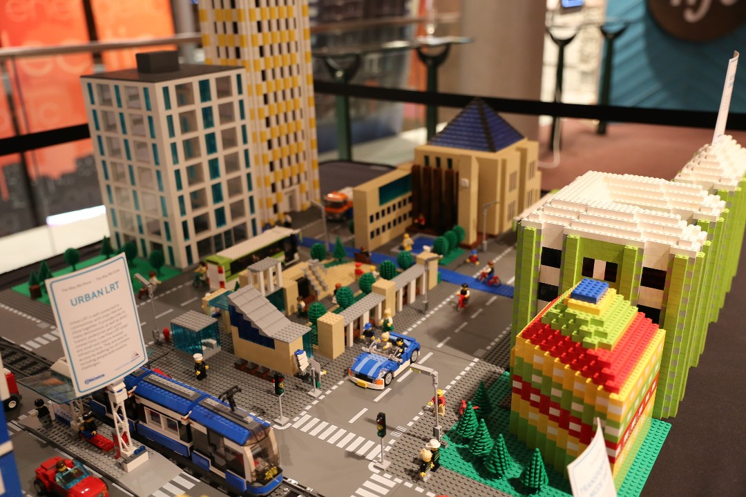 Downtown Edmonton rendered in Lego, with an LRT train in the foreground and City Hall in the back