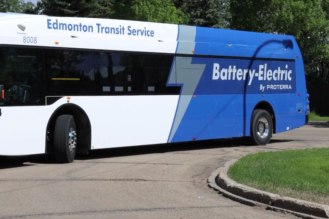 An electric bus in Edmonton Transit Service's fleet, with a decal that reads "battery-electric by Proterra" on the side.