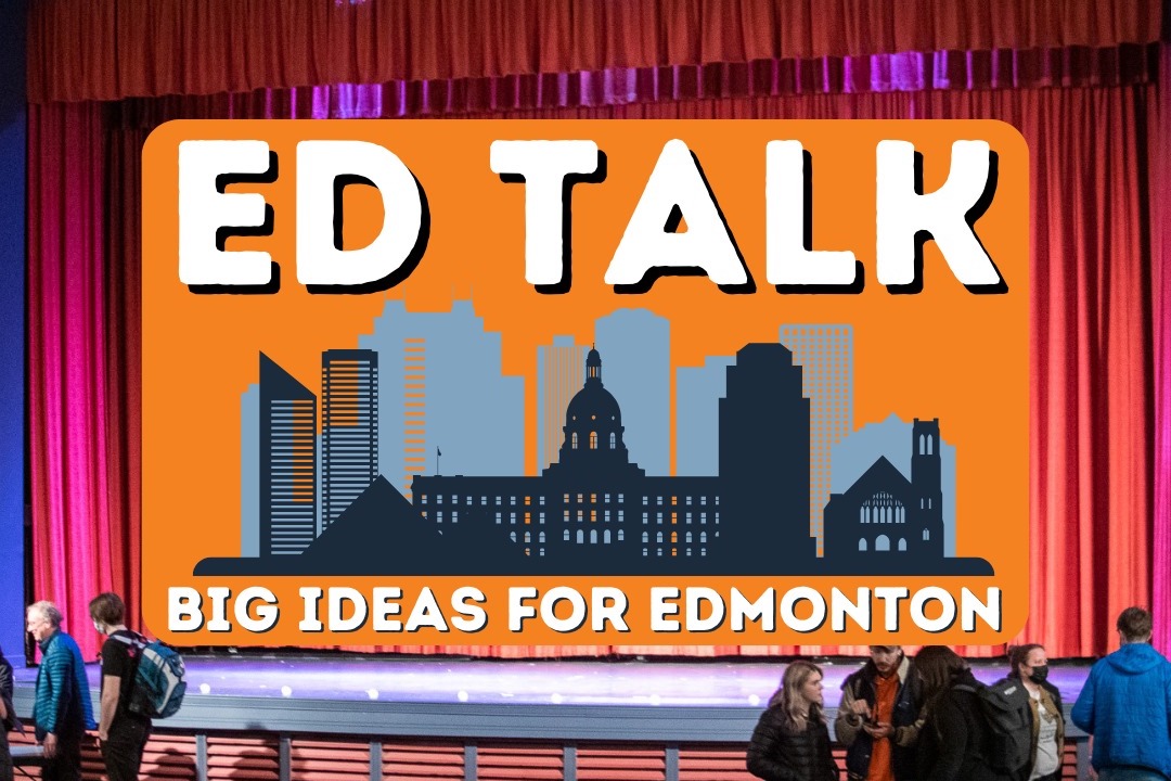 The interior of a theatre with red curtains and people milling about features a superimposed graphic over a movie screen reading "ED TALK: Big Ideas for Edmonton."