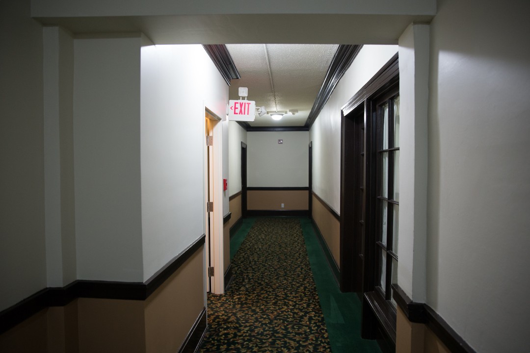 A narrow hallway inside an apartment building in Edmonton.