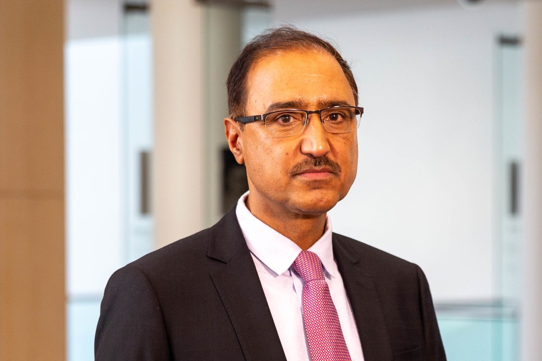 A photograph of Amarjeet Sohi, framed from his shoulders up, taken in 2021.
