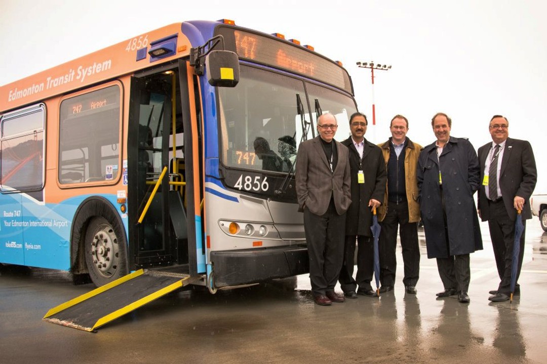 Five men stand beside an Edmonton Transit Service bus.