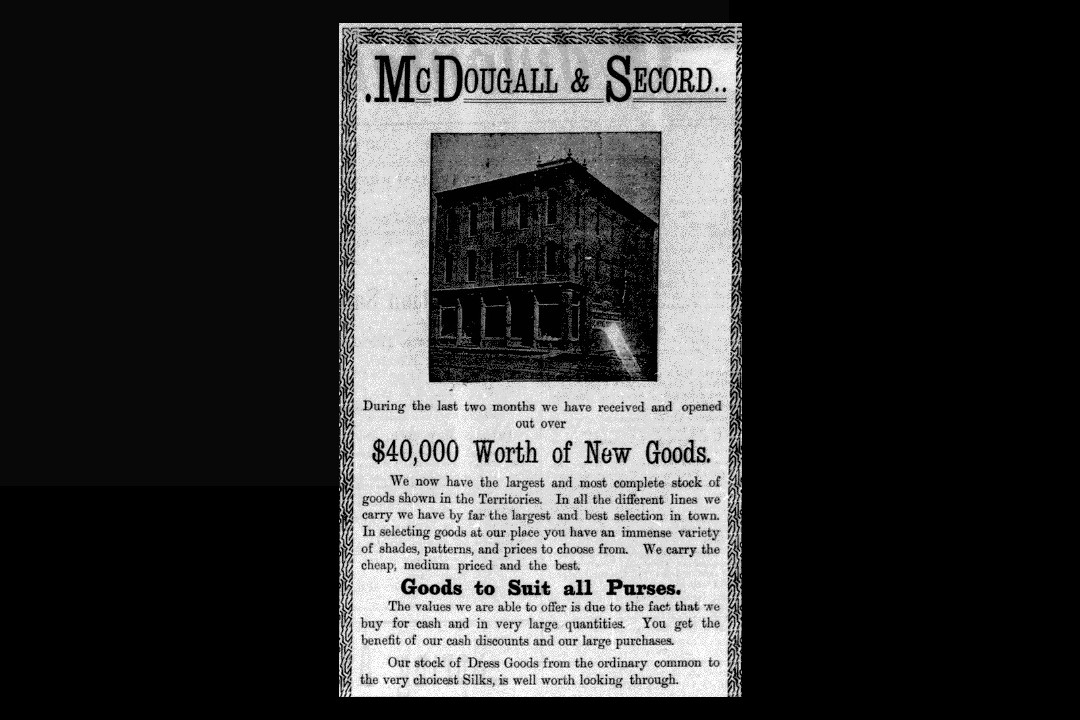 A newspaper clipping of an advertisement for McDougall & Secord, offering "$40,000 Worth of New Goods"