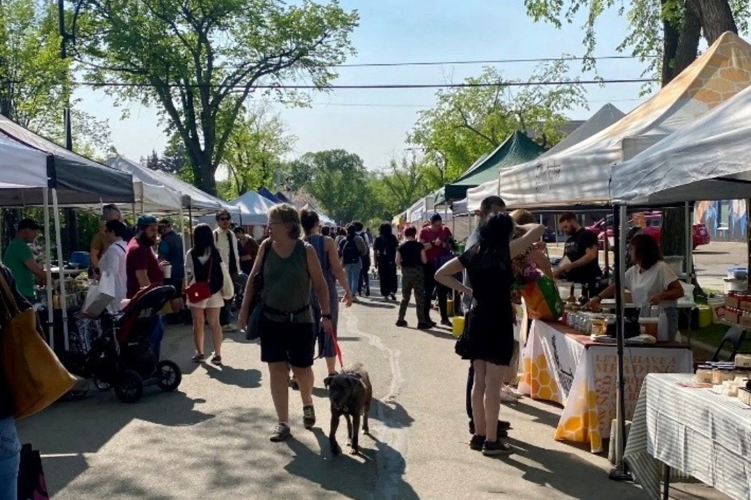 Shoppers visit the 124 Grand Market in 2023.