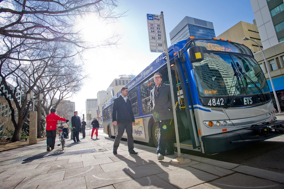 A person steps off an Edmonton Transit Service bus