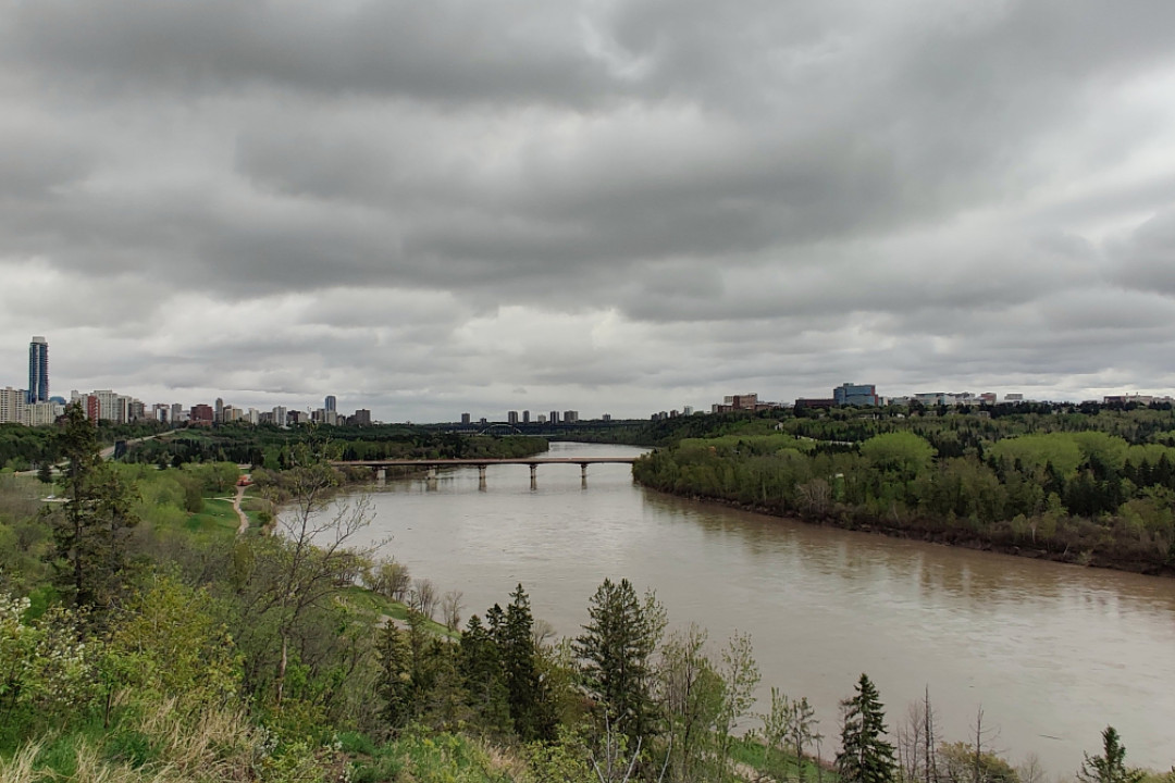 View of Edmonton's river valley on an overcast day, centred on the Groat Road Bridge, facing east