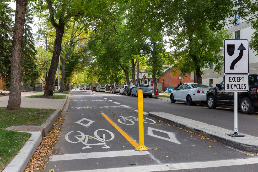 Noted: Taxes, Bill 50, Dreeshen's bike lane visit A two-way bike lane on a tree-lined street in Edmonton.