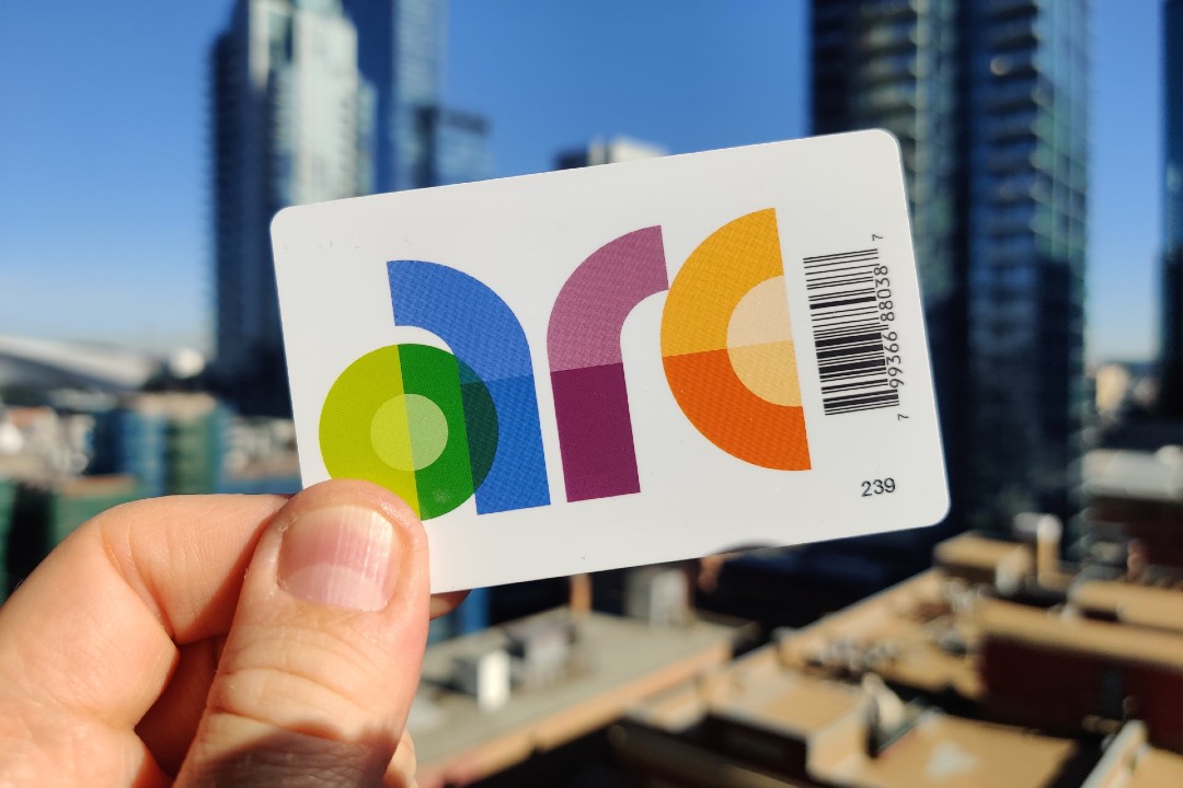 An Edmonton Transit Service Arc card in front of the Edmonton skyline.