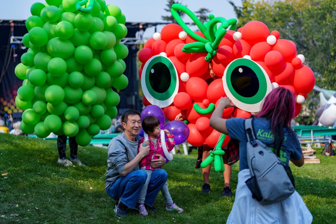 A family poses at the Kaleido Family Arts Festival.