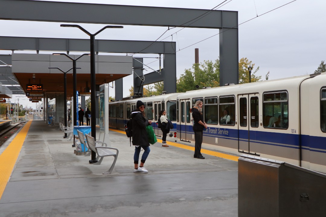 Riders wait for a train at Stadium Station.