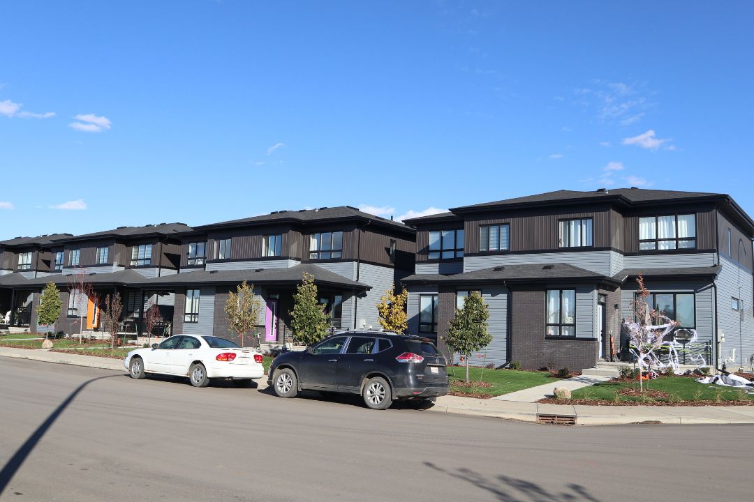 Seven grey and black semi-detached houses in Fort Saskatchewan