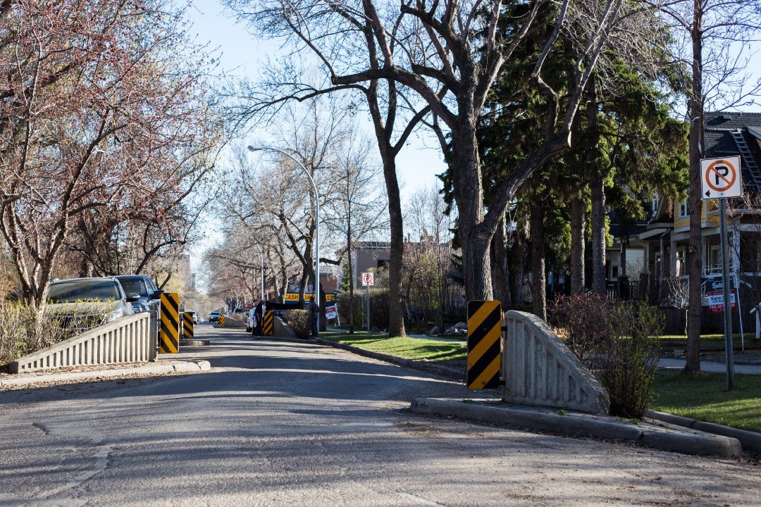 Concrete curb extensions on a residential road.