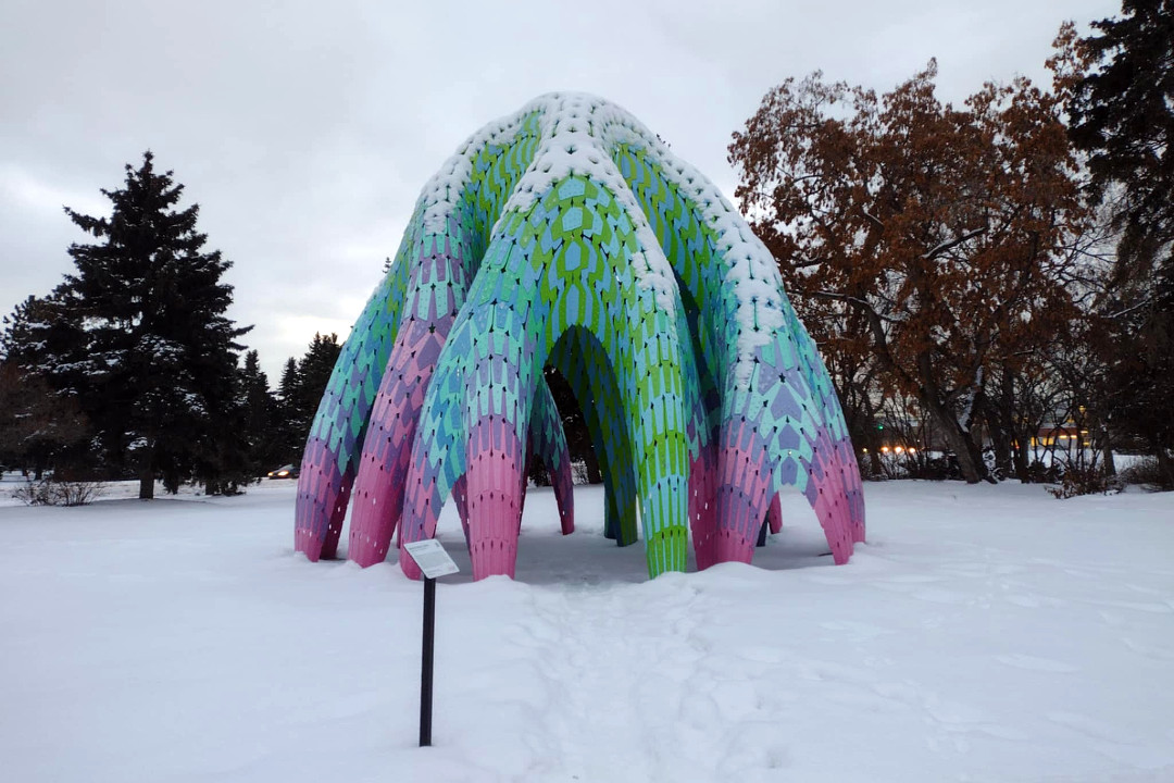 Colourful dome-shaped public art installation in Edmonton's Borden Park on a winter day