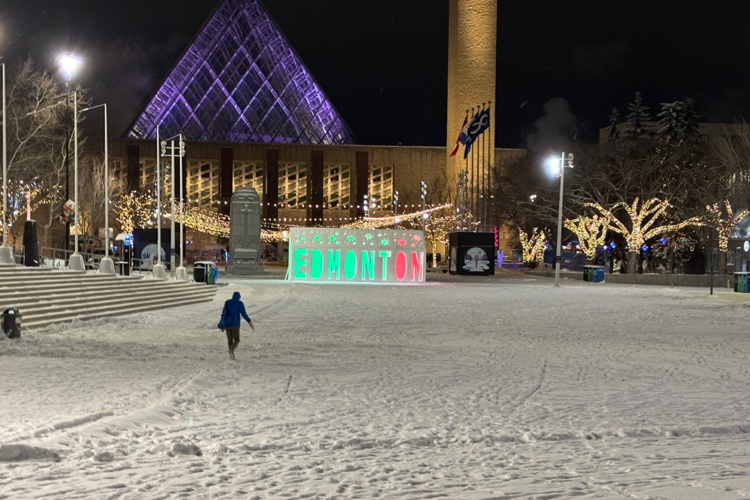 A photo of Edmonton's Churchill Square and a sign that has illuminated letters that spell Edmonton.