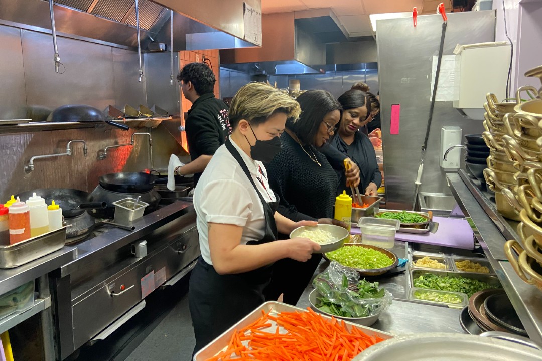 Chefs working in a restaurant kitchen.