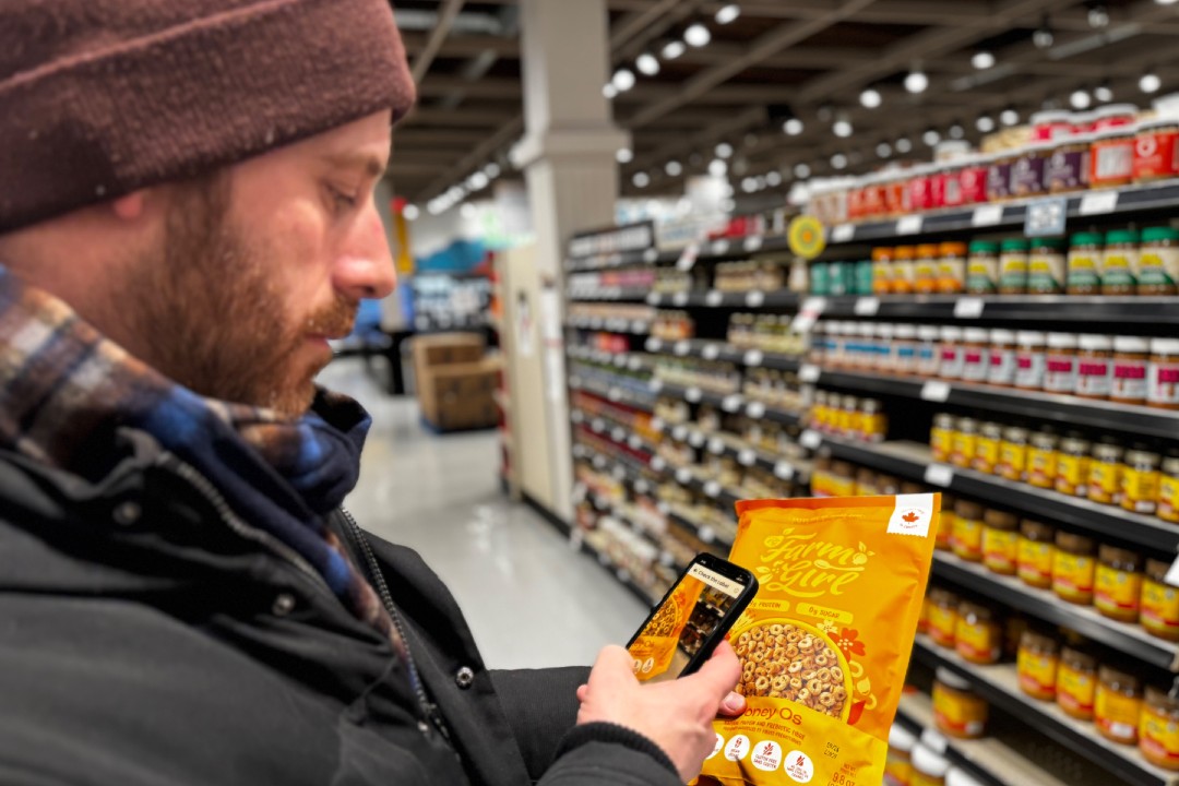 Sam Jenkins of Punchcard Systems uses the Check the Label tool to find product details inside a grocery store.