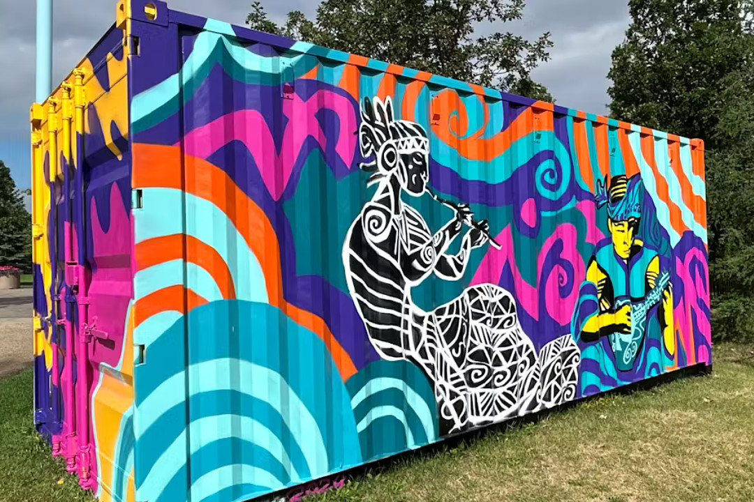 Shipping container painted with bright colours and two figures playing instruments