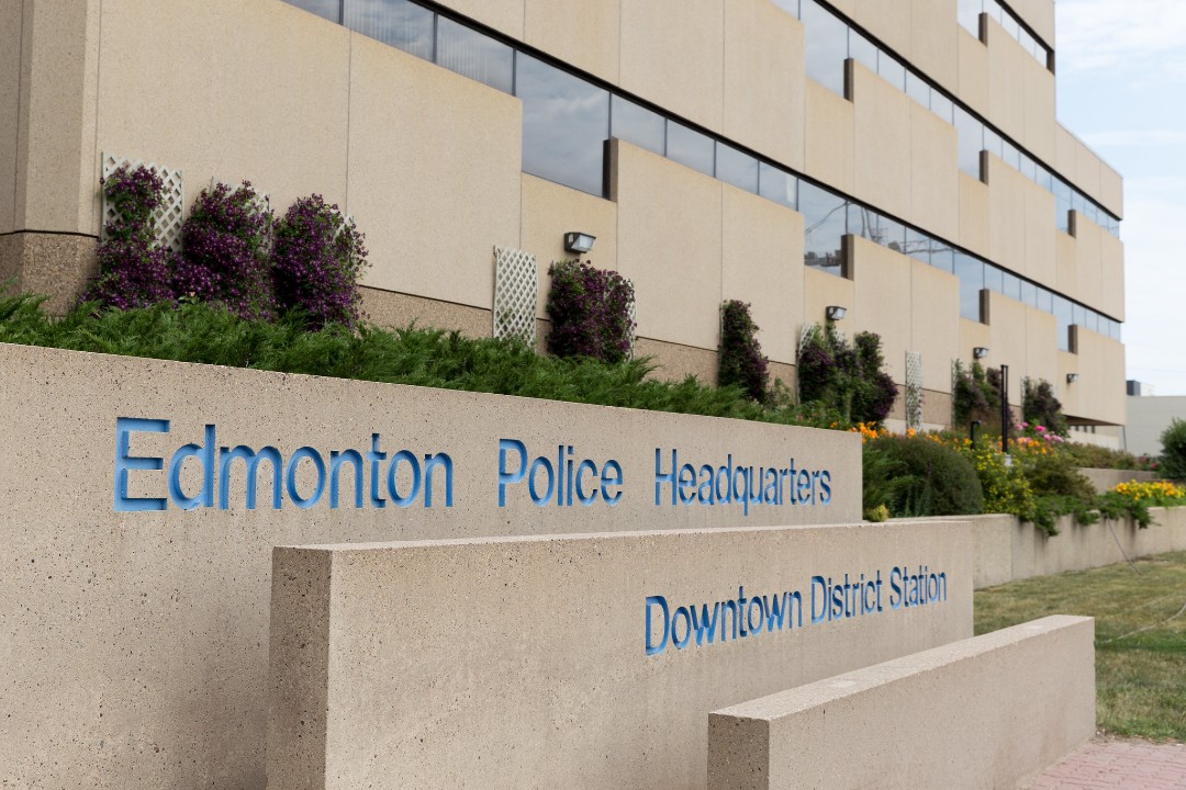 A sign that reads Edmonton Police Headquarters Downtown District Station.