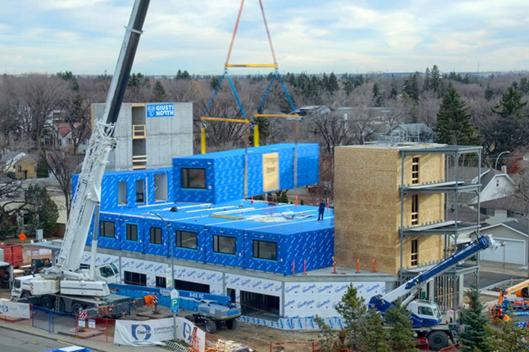 A multi-unit apartment building under construction.
