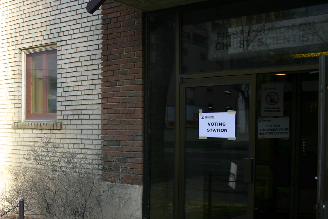 Ban on tabulators means election results will arrive much later in 2025, official says The exterior of a building with a sign that reads "voting station."