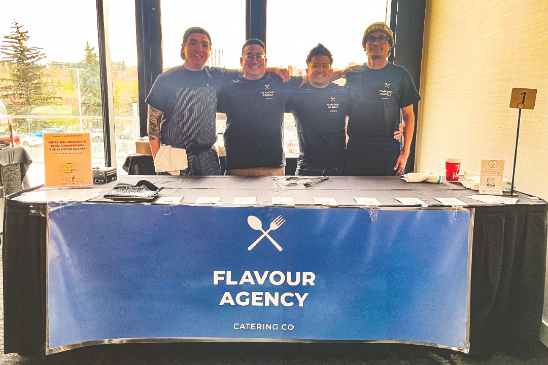 Filistix owners see catering as next chapter after recent restaurant closure Four chefs pose behind a table with a banner that reads Flavour Agency on the front of it.