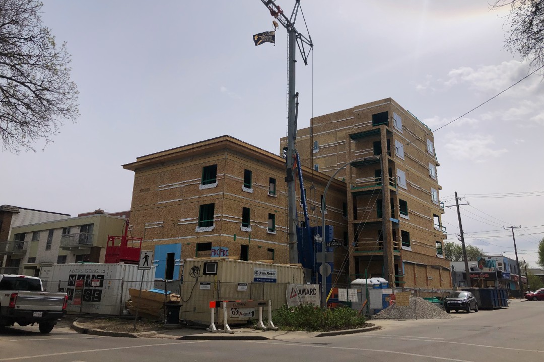On the agenda: Douglas Manor, downtown plan, African Multicultural Community Centre A wood building under construction.