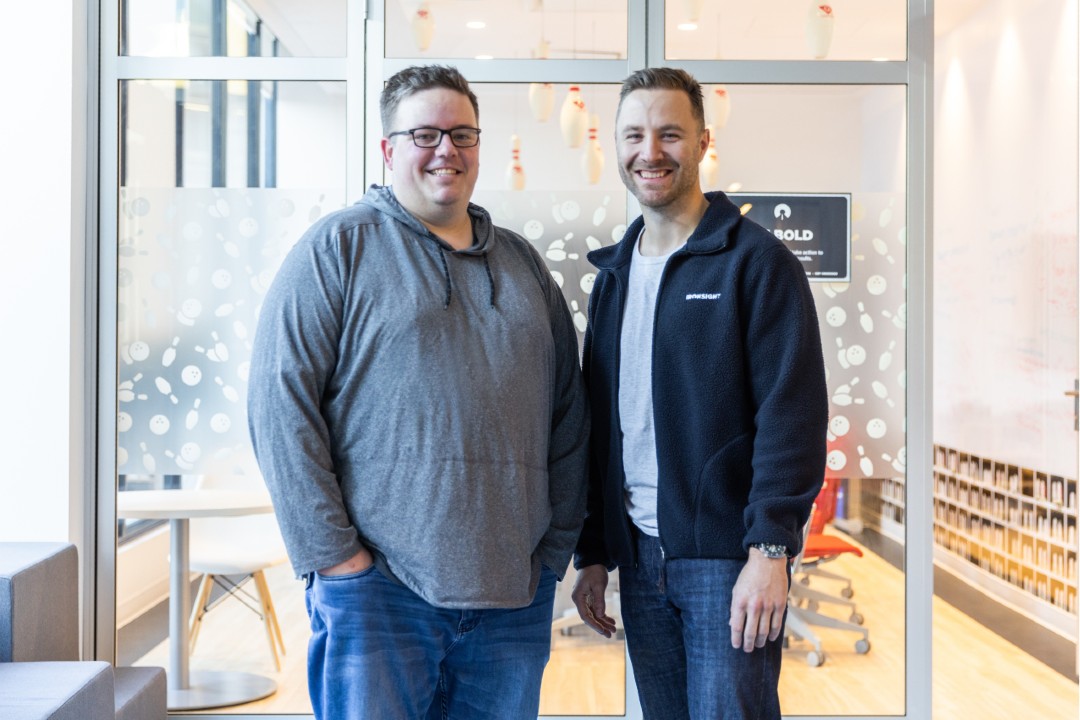 Acquisition sees IronSight aim to become a global company 'overnight' Two smiling men in casual clothes pose for a photo.