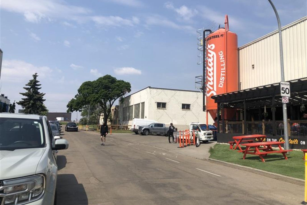 Happy Beer Street brewers propose car-free street for patios and pedestrians A man crosses the road in front of Shiddy's Distilling and, further back, Bent Stick Brewing.