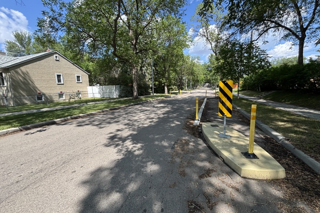 Overhaul of street design standards could help Edmonton's finances Concrete barriers act to narrow a road in a mature neighbourhood.