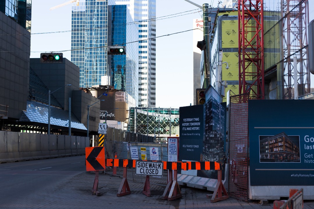 Construction in downtown Edmonton with the Edmonton City Centre mall in the background.