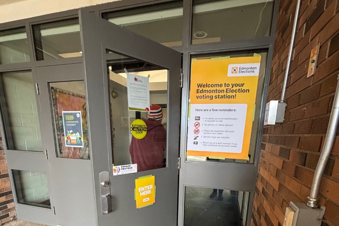 A person walks into a voting station on Oct. 20, 2025.