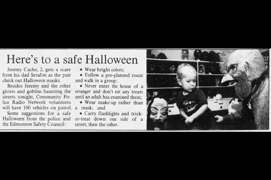 A newspaper clipping that shows a small child and someone in a chicken mask.