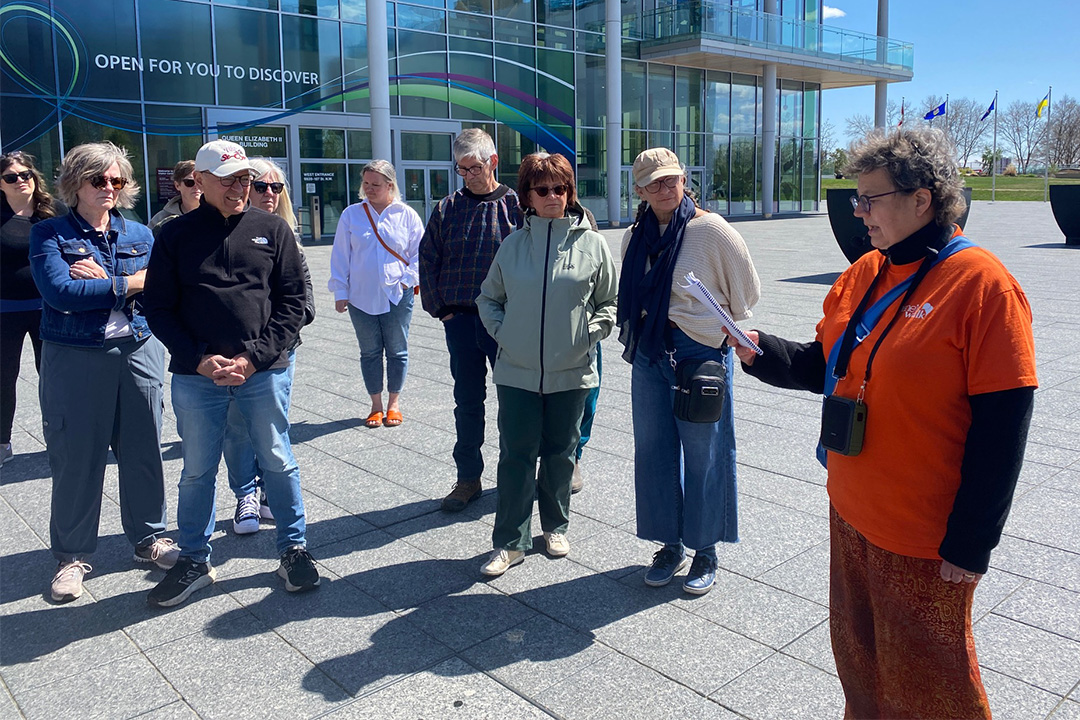 Jane's Walk participants and leader in front of the Alberta Legislature