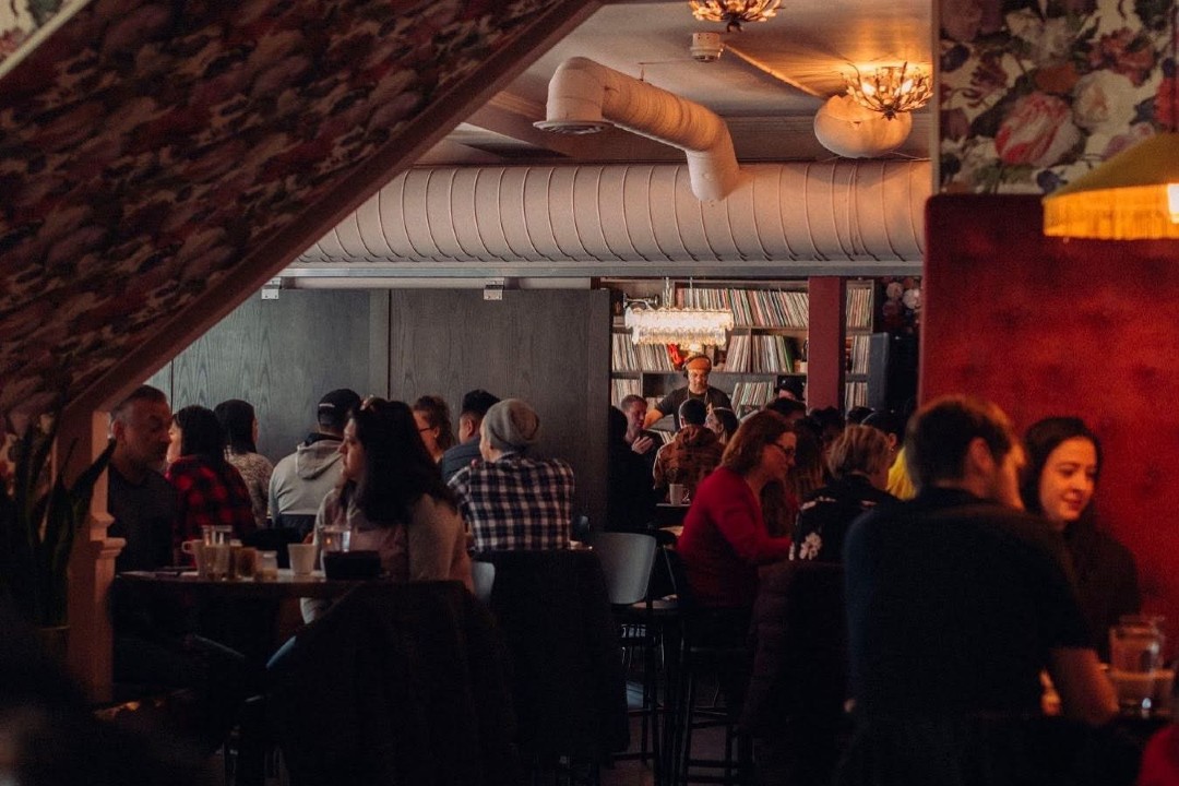 A restaurant filled with diners.