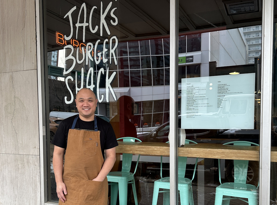 Tu Le in front of the Jack's Burger Shop on Jasper Avenue in downtown Edmonton