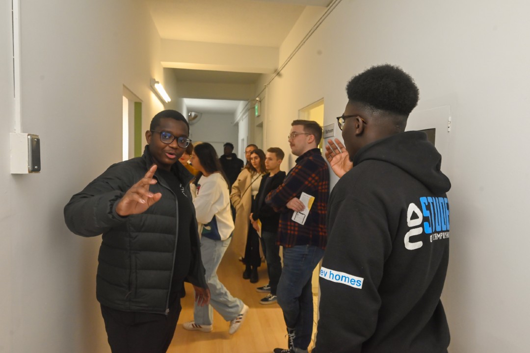 Students and staff from The Hive gather in a hallway
