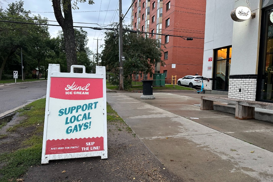 A sign in front of Kind Ice Cream reads "Support local gays"