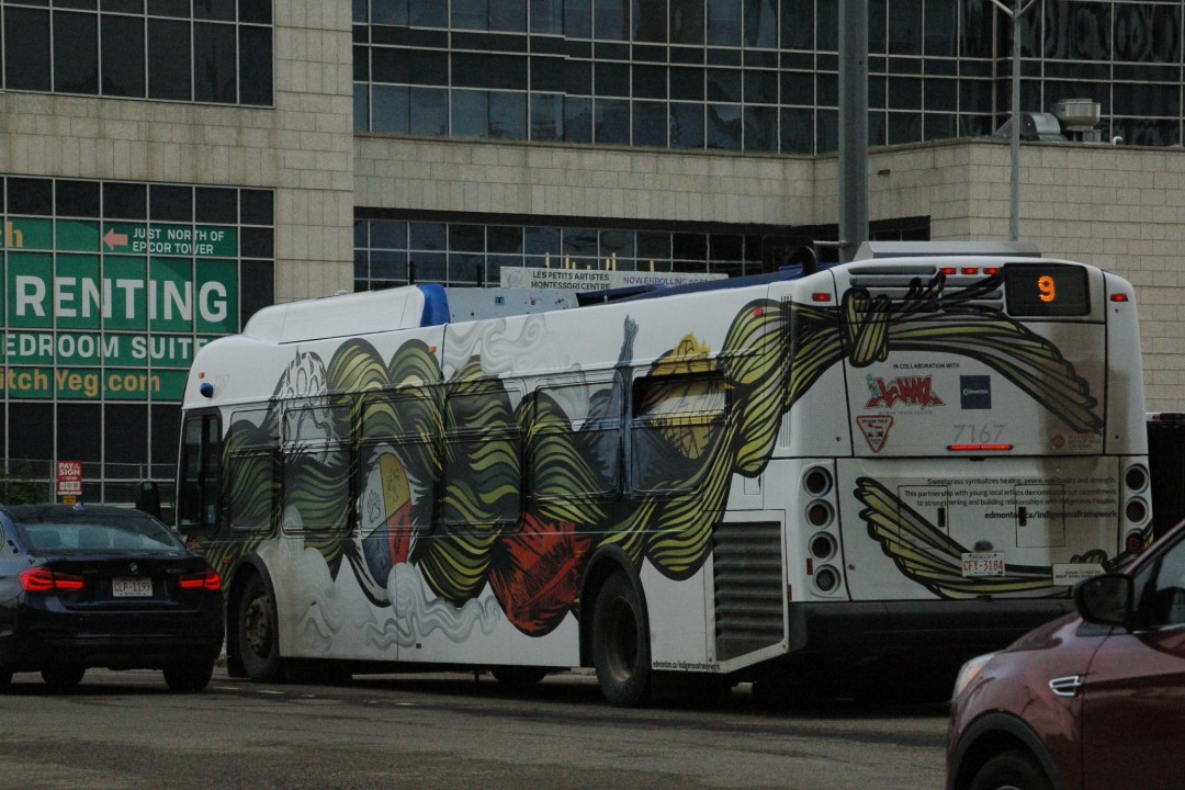 A bus wrapped in a work of art featuring sweetgrass and a medicine wheel