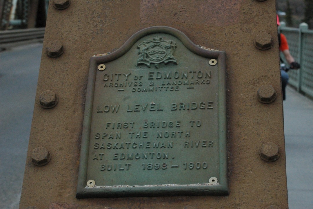 A rusty iron plaque from the City of Edmonton on the Low Level Bridge, the 'first bridge to span the North Saskatchewan River at Edmonton, built 1898-1900'