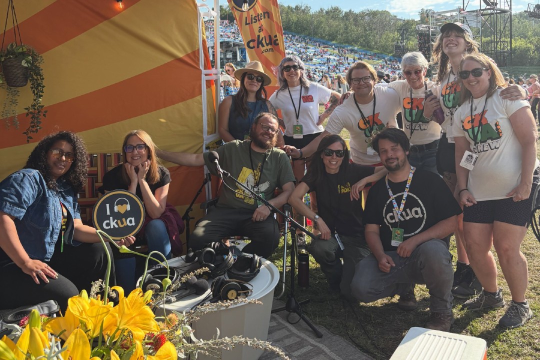 A group people wearing CKUA shirts at the Edmonton Folk Music Festival